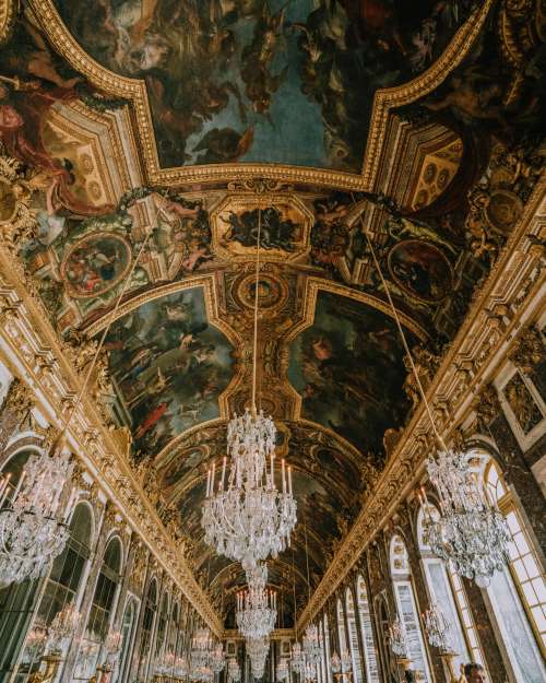 Gold-Trimmed Frescoes And Crystal Chandeliers Photo