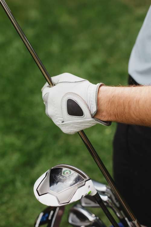 Golfer Holds Club With Gloves Photo