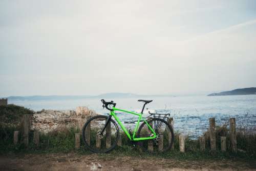 Green Bike By Water Photo