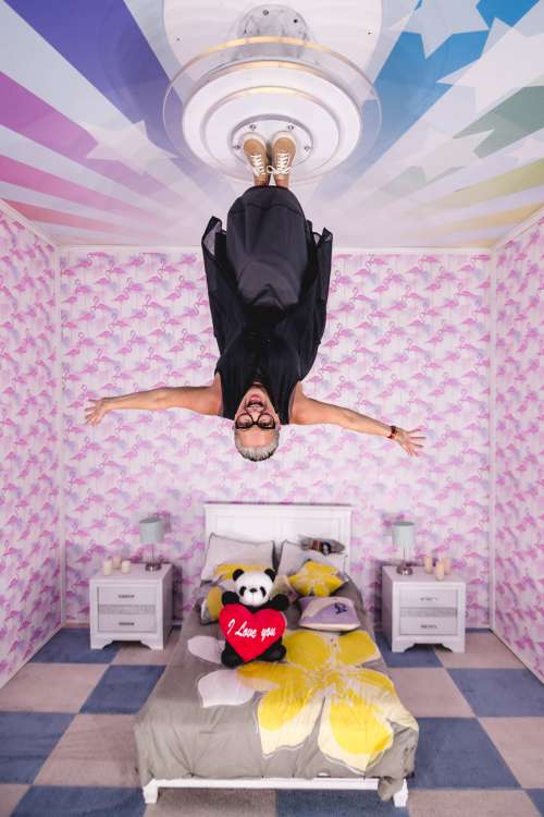Happy woman In upside Down Playroom Photo