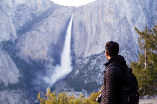 Hiker Views Waterfalls Photo