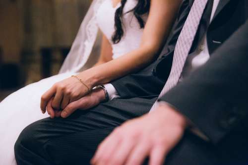 Holding Hands On Wedding Day Photo