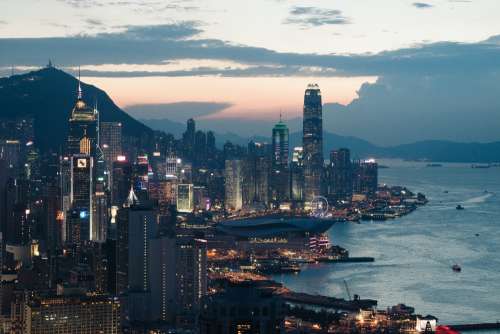 Hong Kong City By Ocean At Sunset Photo