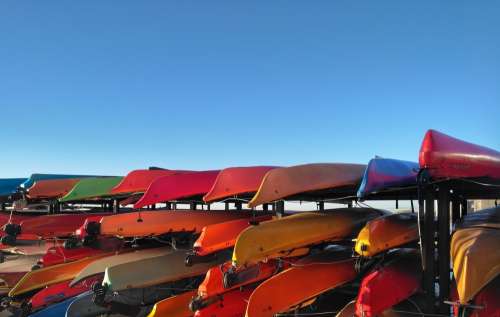 Kayaks On Racks Under Blue Sky Photo