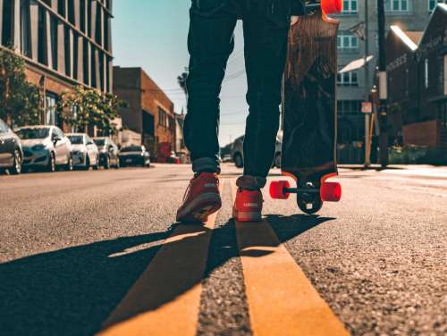Longboarder On Urban Street Photo