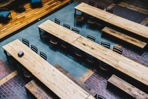 Long Wooden Tables From Above Photo