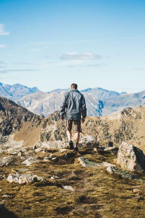 Man Hiking In Mountains Photo