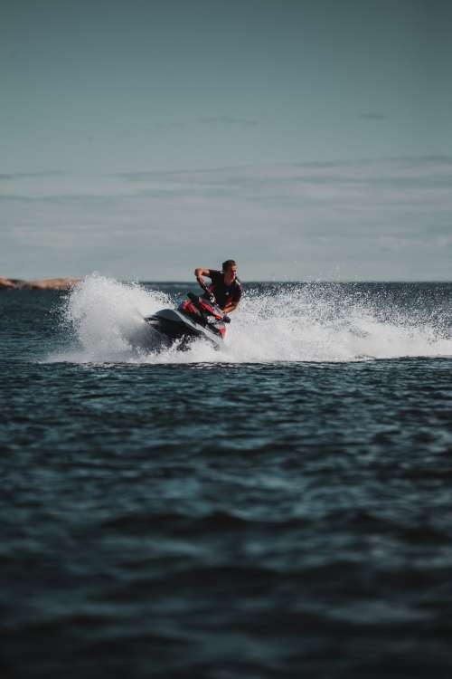 Man Takes Sharp Turn On Jet Ski Photo