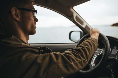Man With Glasses Driving Photo