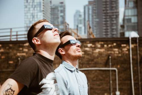Men Look At Sun Photo