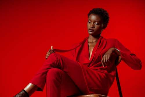 Model Poses In Red Pansuit Photo