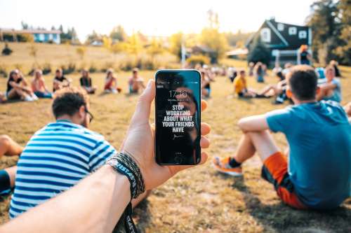 Motivational Message On Mobile At Outdoor Event Photo