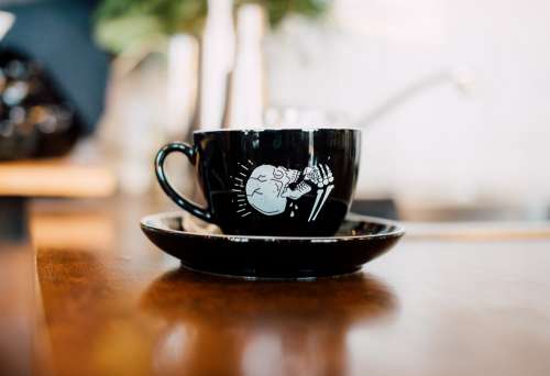Mug With Skeleton Drinking Coffee Photo