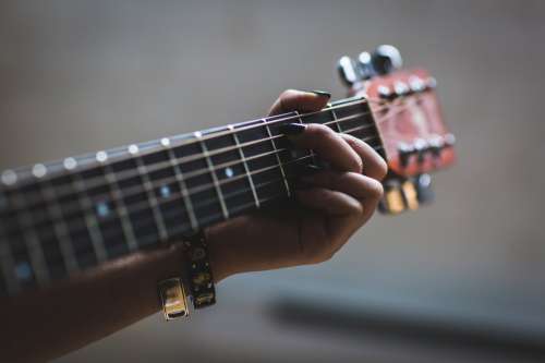 Musician Playing Guitar Photo