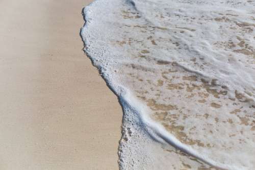 Ocean Water On Beach Sand Photo