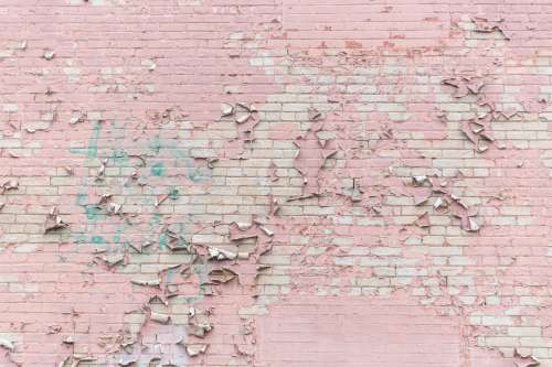 Pink Paint Peeling Off Brick Wall Texture Photo
