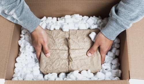 Placing A Package In Packing Material Photo