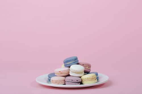 Plate Of Pastel Macarons With Negative Space Photo