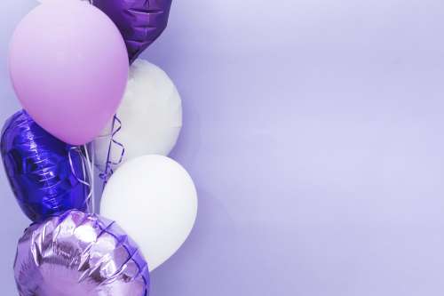 Purple Balloons On The Left Side Photo