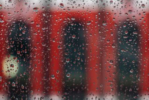 Rainy Window With Red Streetcar Photo