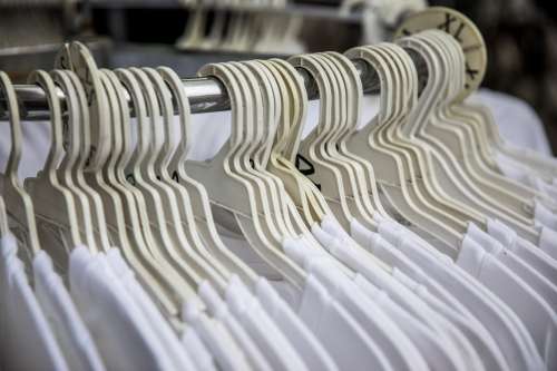 Rows Of Hangers With White T-Shirts Photo