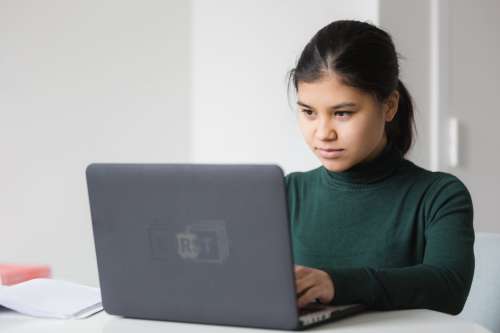 Serious Woman With Laptop Photo