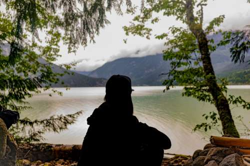 Silhouette Of A Young Person Looking At The Landscape Photo