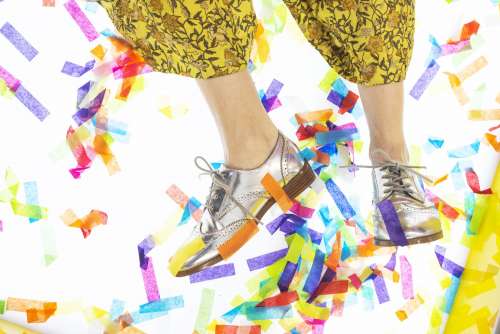 Silver Shoes Dancing Through Confetti Photo