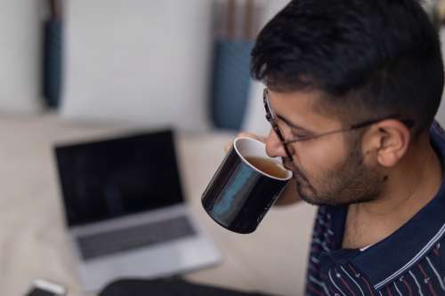 Sipping Tea In Modern Workspace Photo