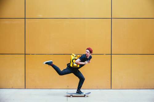 Skateboarder Rides Past Photo