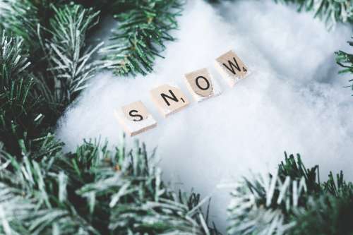 Snow Letter Tiles With Winter Greens Photo