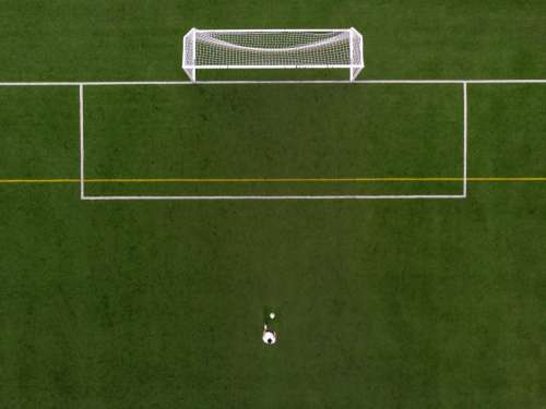 Soccer Player In Penalty Kick Position Drone View Photo
