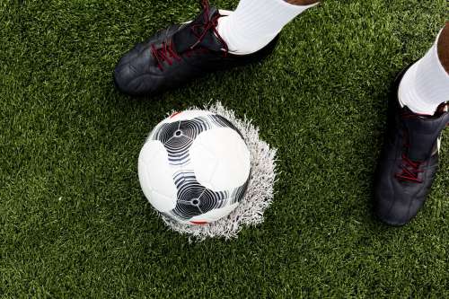 Soccer Player With Ball On Field Photo