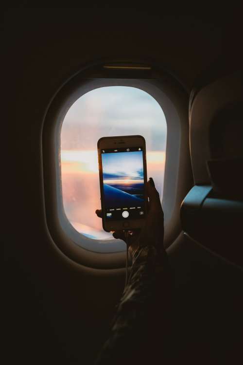 Taking A Picture Through Plane Window Photo