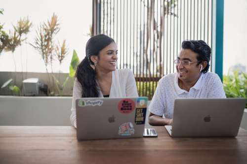 Team Shares A Laugh In Modern Coworking Space In India Photo