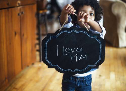 Toddler With Sign For Mom Photo