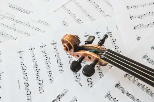 Top Of Violin On Music Sheets Photo