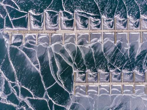 Two Piers On Frozen Sea Photo