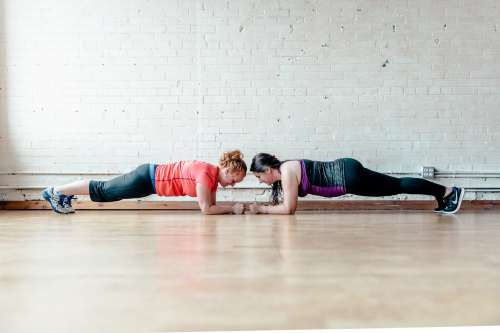 Two Women Planking Together Photo