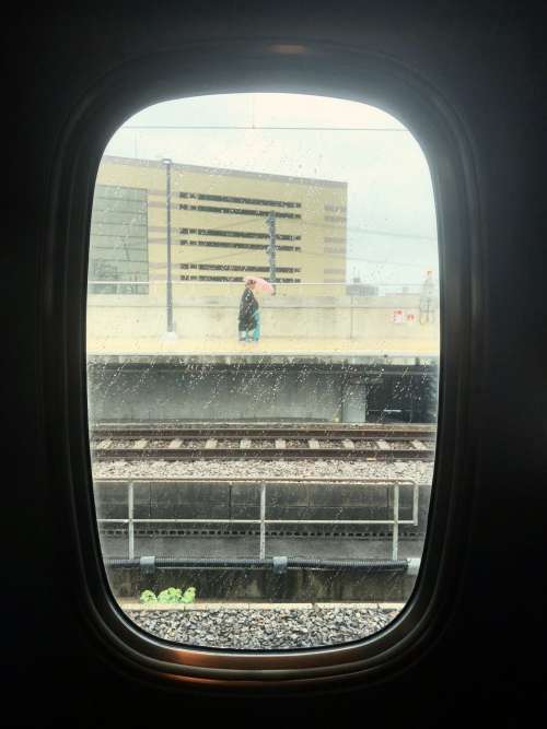View Through A Train Window In The Rain Photo