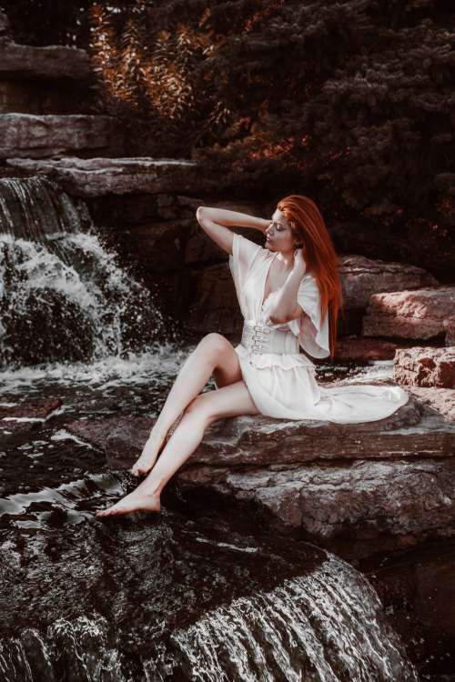 Woman By Waterfall Photo