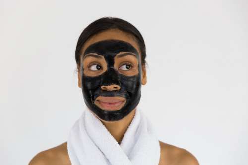 Woman With Charcoal Face Mask Photo