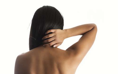 Woman Hand On Back Neck Photo