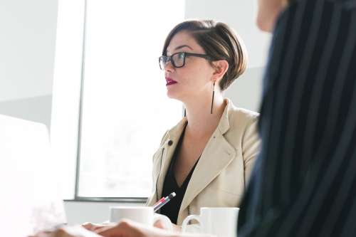 Woman In Glasses At Meeting Photo