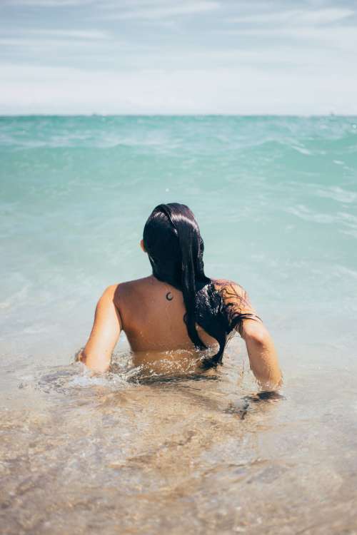 Woman Swims In Ocean Photo