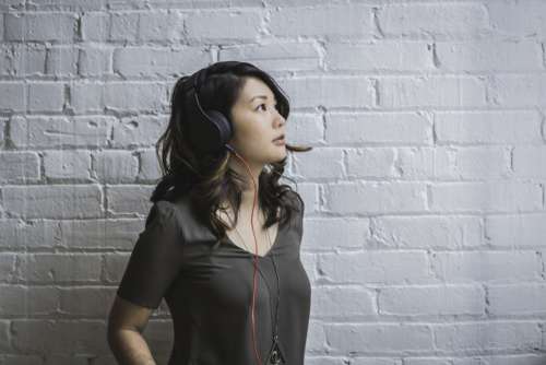 Woman Wearing Headphones Photo