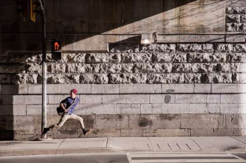 Young Man Runaway On Urban Street Photo