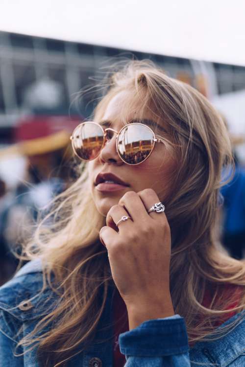 Young Woman In Sunglasses With Rings Photo