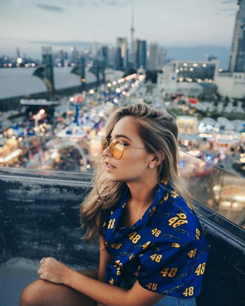 Young Woman On Ferris Wheel Photo