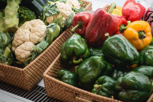 Bell peppers and other fresh vegetables in a store